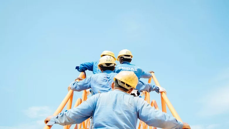 Construction workers sky