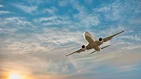 Plane flying sunset.jpg Plane flying sunset.jpg