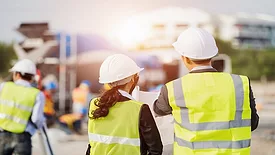 Construction site plan workers