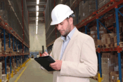 Inspector with clipboard and hardhat image