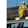 A Construction Worker Protected by a Guardrail and a Fall Arrest System