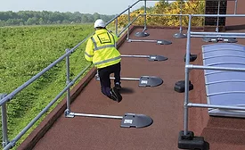 safety-rail-source-KeeGuard_PVC_man_walking_on_roof.jpg