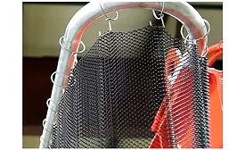 Steel curtains block flying debris from hydraulic presses
