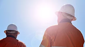 Workers in rising summer heat