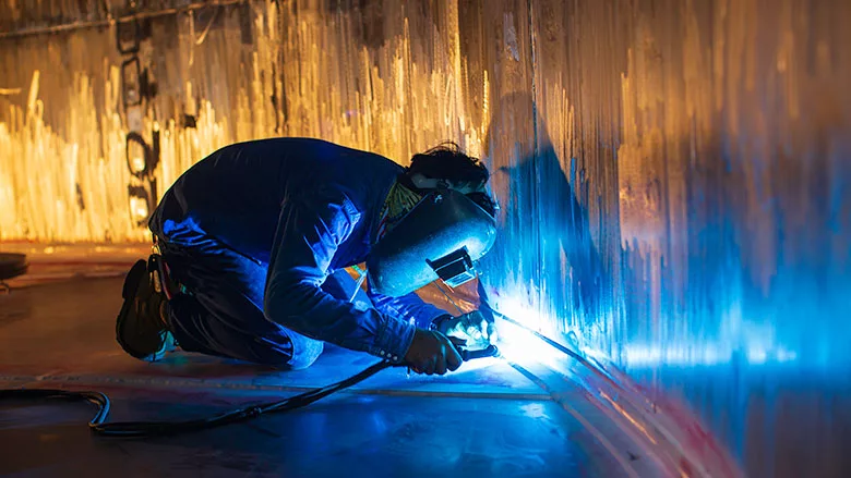A welder in a confined space