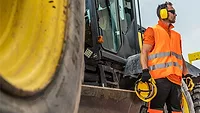 man wearing PPE on a construction site man wearing PPE on a construction site