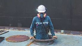 worker entering a confined space