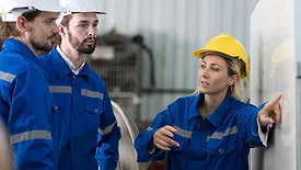 safety manager gives direction to workers