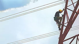electrical worker climbing a tower