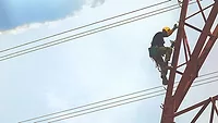 electrical worker climbing a tower