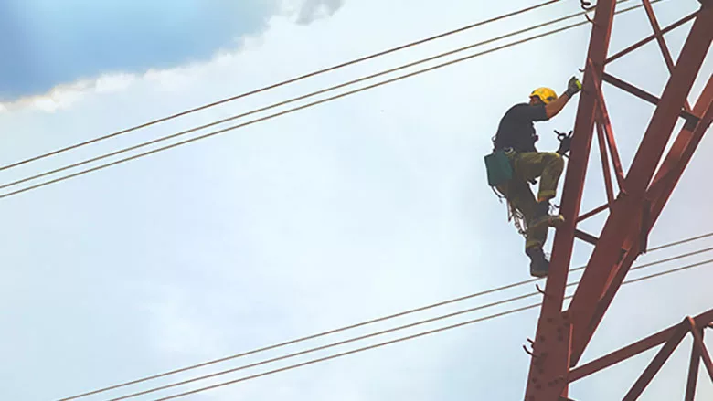 electrical worker climbing a tower