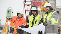 a construction crew working in winter weather a construction crew working in winter weather