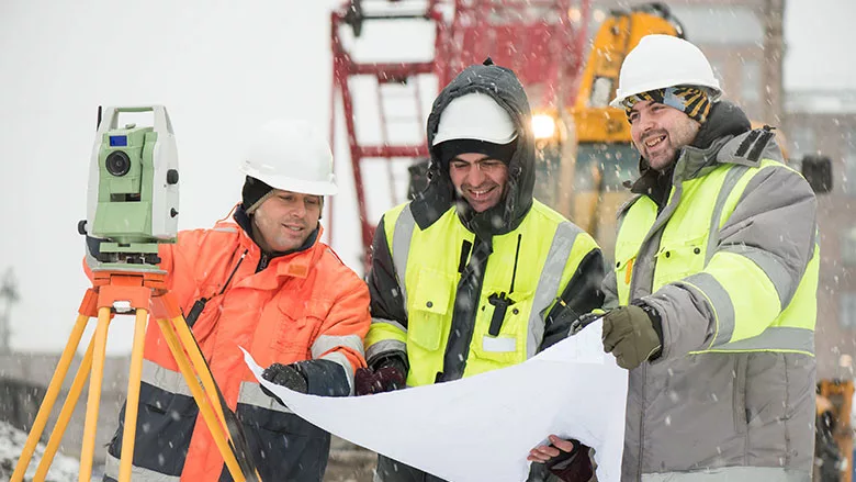 a construction crew working in winter weather