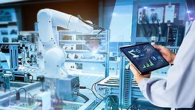 This image depicts a smart industrial control concept where a robotic arm is utilized in manufacturing. 