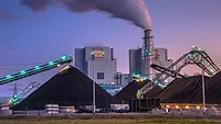 a coal-fired power station, a type of industrial facility that burns coal to produce electricity a coal-fired power station, a type of industrial facility that burns coal to produce electricity