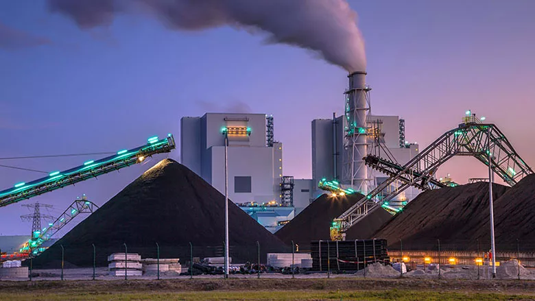 a coal-fired power station, a type of industrial facility that burns coal to produce electricity