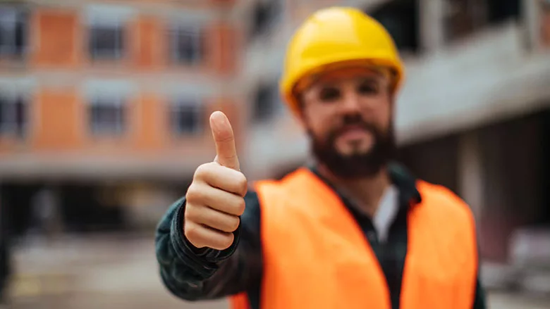 construction worker giving thumbs-up
