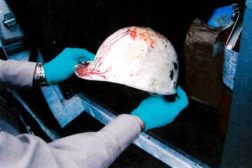 OSHA investigator documents the helmet of a fallen tower climber.